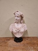 A 19th C. WHITE MARBLE BUST OF A LADY WEARING A ROSE IN HER LACE TRIMMED BODICE SUPPORTED ON A BLACK