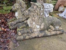 A PAIR OF OLD WEATHERED GARDEN FIGURES OF LARGE RECUMBENT LIONS.