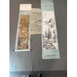 A CHINESE SCROLL DEPICTING FIGURES ENJOYING SPRING BLOSSOMS. 125 x 32.5cms. A BLACK AND WHITE SCROLL