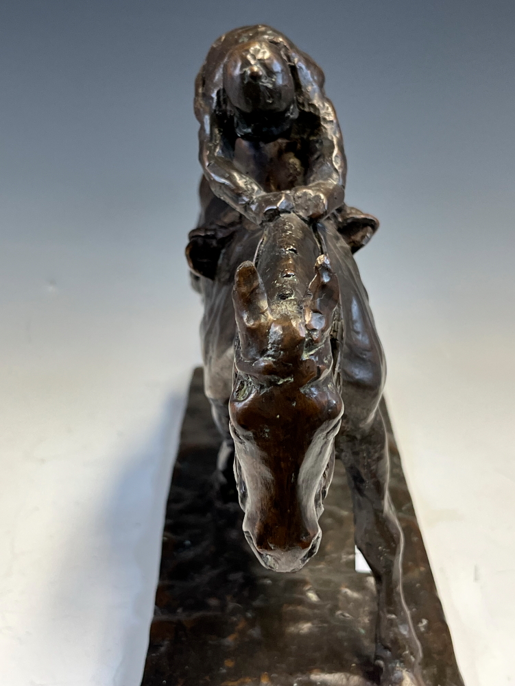A 20th C. BRONZE HORSE WITH THE JOCKEY CROUCHED OVER ITS NECK, THE RECTANGULAR BASE. W 31.5cms. - Image 8 of 10