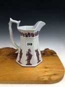 A VICTORIAN PINK LUSTRE PUZZLE JUG, THE FLARED OCTAGONAL SIDES WITH KNIGHTS IN ARMOUR IN RELIEF