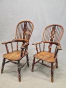 A NEAR PAIR OF YEW AND ELM TALL BACKED WINDSOR CHAIRS