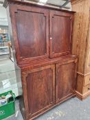A 19th C. MAHOGANY PRESS, THE DOORS TO THE RECESSED UPPER HALF AND THE BASE CLOSING ON A BRASS
