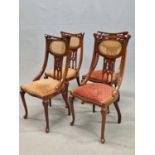 A SET OF FOUR 20th C. MAHOGANY CHAIRS, EACH TOP RAIL CURVED ABOVE FLORAL PIERCING IN THE ART NOUVEAU