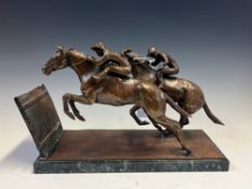 BARRY FOLEY, HIS 1972 BRONZE OF TWO RACEHORSES ABOUT TO TAKE A FENCE, THE RECTANGULAR BASE ON A