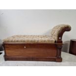 A VICTORIAN MAHOGANY CHAISE LONGUE, THE BUTTON UPHOLSTERED SEAT OPENING ONTO A COFFER BASE, THE