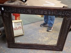 A VICTORIAN RECTANGULAR MIRROR IN AN OAK FRAME CARVED AT THE TOP WITH OCCULTUS NON EXTINCTUS. 65 x