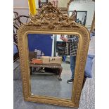 A 19th C. FRENCH RECTANGULAR MIRROR, THE GILT FRAME CRESTED BY A HEART SHAPE FLANKED BY WINGED