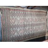 A TRIBAL FLAT WEAVE RUG 244 x 136cms