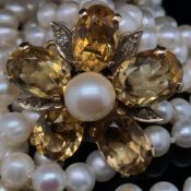 A FOUR ROW CULTURED PEARL CHOKER WITH A GEMSET AND DIAMOND FIVE ROW CLASP, THE FIFTH ROW OF PEARLS