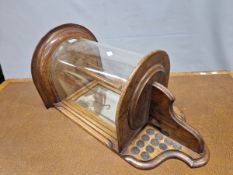 AN EARLY 20th C. OAK WALL MOUNTING SPORTS TROPHY CASE, THE HALF ROUND GLAZED TOP BACKED BY A