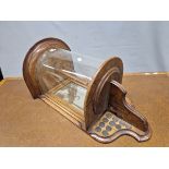 AN EARLY 20th C. OAK WALL MOUNTING SPORTS TROPHY CASE, THE HALF ROUND GLAZED TOP BACKED BY A