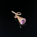 ANTIQUE HUNTING HORN POCKET WATCH KEY SET WITH PURPLE GEMSTONE. UNHALLMARKED, ASSESSED AS 9ct