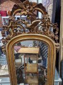 A 19th C. PIER GLASS AND SUPPORTING BRACKET, THE ROUND ARCH TOPPED RECTANGULAR PLATE WITHIN A GILT