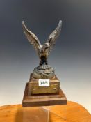 A BRONZED EAGLE ON A MAHOGANY PLINTH WITH THE BRASS LABELS INSCRIBED THE EAGLE HAS LANDED, NEIL