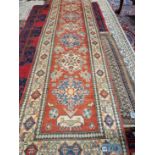 AN ORIENTAL RUNNER OF CAUCASIAN DESIGN 340 X 86 CM, TOGETHER WITH A SMALL ANTIQUE BELOUCH RUG (2)