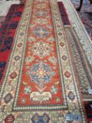 AN ORIENTAL RUNNER OF CAUCASIAN DESIGN 340 X 86 CM, TOGETHER WITH A SMALL ANTIQUE BELOUCH RUG (2)