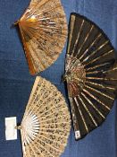 A HONITON LACE FAN WITH MOTHER OF PEARL STICKS, ANOTHER LACE FAN TOGETHER WITH ANOTHER FAN WITH