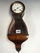 A GLAZED ROSEWOOD WALL CLOCK THE ENAMEL DIAL INSCRIBED HENRI MARC, THE MOVEMENT STRIKING ON A BELL