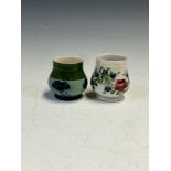 TWO MACINTYRE MOORCROFT SMALL VASES, ONE SLIP TRAILED WITH SWAGS OF FLOWERS AND THE OTHER WITH