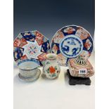 TWO JAPANESE IMARI PLATES, A ROUNDED SQUARE INCENSE JAR, COVER AND WOOD STAND, A CHINESE BOWL AND