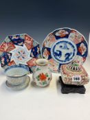 TWO JAPANESE IMARI PLATES, A ROUNDED SQUARE INCENSE JAR, COVER AND WOOD STAND, A CHINESE BOWL AND