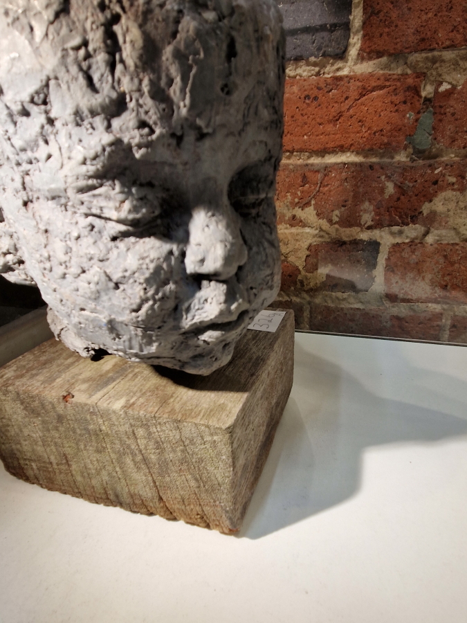 A SCULPTED HEAD OF A CHILD MOUNTED ON A SQUARE WOODEN PLINTH.   H 31cms. - Image 3 of 6