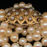 A DOUBLE ROW OF UNIFORM CULTURED PEARLS. ROW ONE LENGTH 47cms, ROW TWO LENGTH 51cms. THE DOUBLE