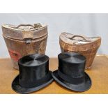 TWO LEATHER CASED BLACK TOP HATS WITH SILK PILE, ONE BY LOCKE. 20 x 16cms. AND THE OTHER BY WHITE.