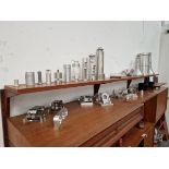 AN INTERESTING DISPLAY SELECTION OF FINELY MACHINED ALLOY INDUSTRIAL PARTS.
