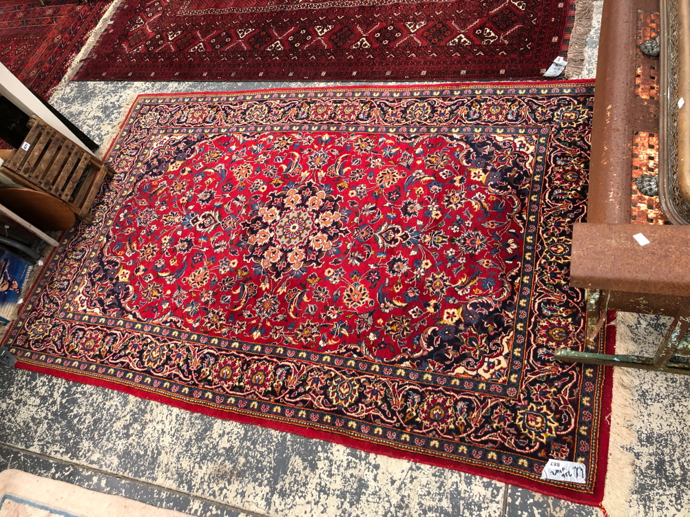 A PERSIAN KASHAN RUG. 216 x 42cms