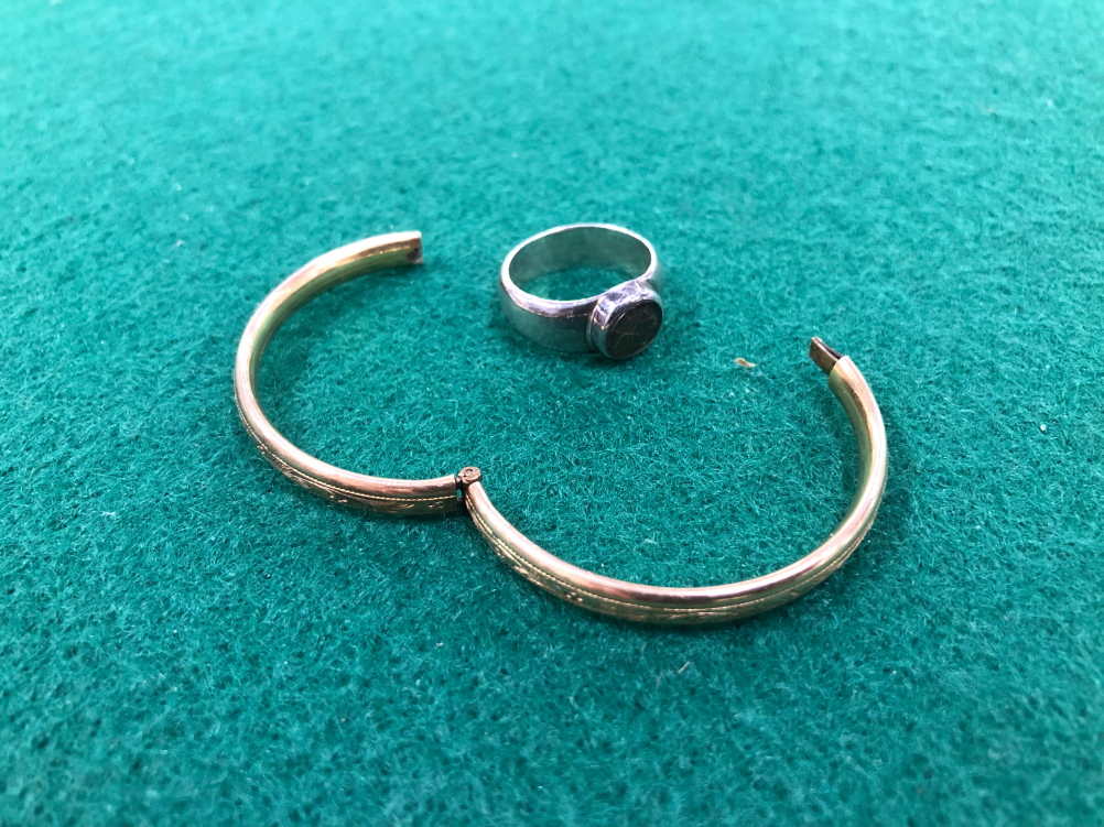 A SILVER RING AND A CHILDS GOLD BANGLE.