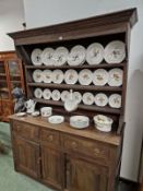 A 19th C. OAK SMALL DRESSER WITH PLATE RACK. 191 X 150 X 52CMS.