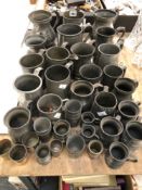 A COLLECTION OF PEWTER MUGS AND MEASURES