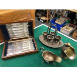 A HALLMARKED SILVER SAUCEBOAT, A SET OF SILVER HANDLED CUTLERY, A PLATED EGG CUP SET ETC.