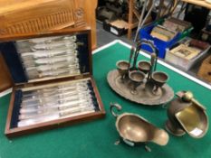 A HALLMARKED SILVER SAUCEBOAT, A SET OF SILVER HANDLED CUTLERY, A PLATED EGG CUP SET ETC.