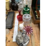 A CRANBERRY GLASS DECANTER, A SPIRIT DECANTER, GLASS JARS AND AN ELECTROPLATE FOUR BOTTLE CRUET
