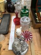 A CRANBERRY GLASS DECANTER, A SPIRIT DECANTER, GLASS JARS AND AN ELECTROPLATE FOUR BOTTLE CRUET