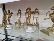 A PAIR OF BRASS HORSES, A PAIR OF BRASS CUPIDS TOGETHER WITH FOUR BRASS PLATE STANDS