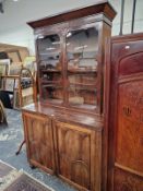 A REGENCY MAHOGANY LINEN PRESS CABINET AND AN ASSOCIATED GLAZED BOOKCASE. OVERALL MEASUREMENTS 219 X