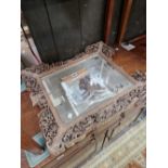 A RECTANGULAR MIRROR WITHIN A CHINESE PIERCED AND CARVED WOOD FRAME