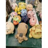A COLLECTION OF CERAMIC PIG MONEY BOXES
