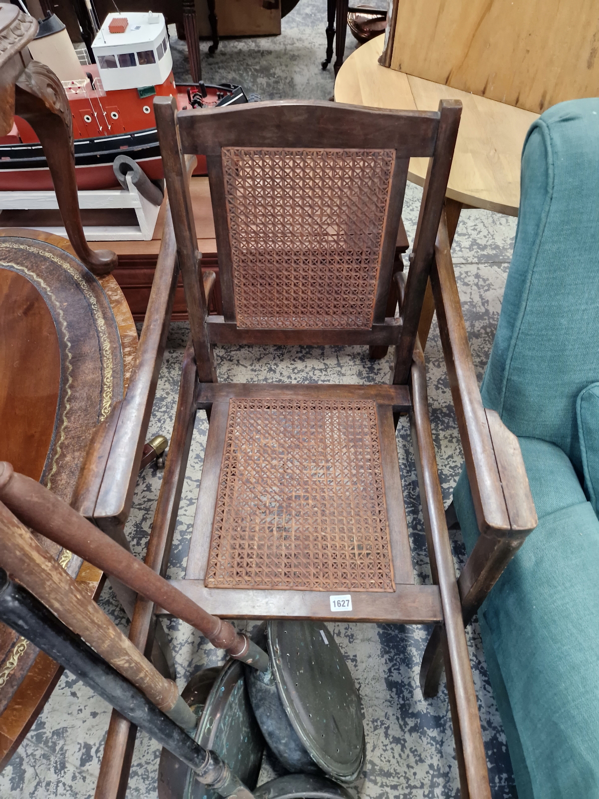 A VINTAGE SEDAN TYPE CHAIR.