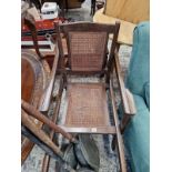 A VINTAGE SEDAN TYPE CHAIR.