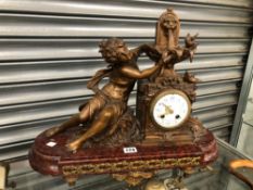 A 19th C. FRENCH SPELTER AND RED MARBLE CLOCK FLANKED BY A NYMPH RAISING HANDS UP TO A WATER