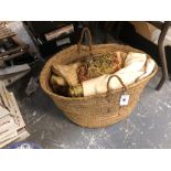 A BASKET OF WOVEN AND OTHER TEXTILES