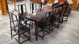 A GOOD QUALITY ORIENTAL HARDWOOD EXTENDING DINING TABLE COMPLETE WITH 8 CHAIRS OF TRADITIONAL