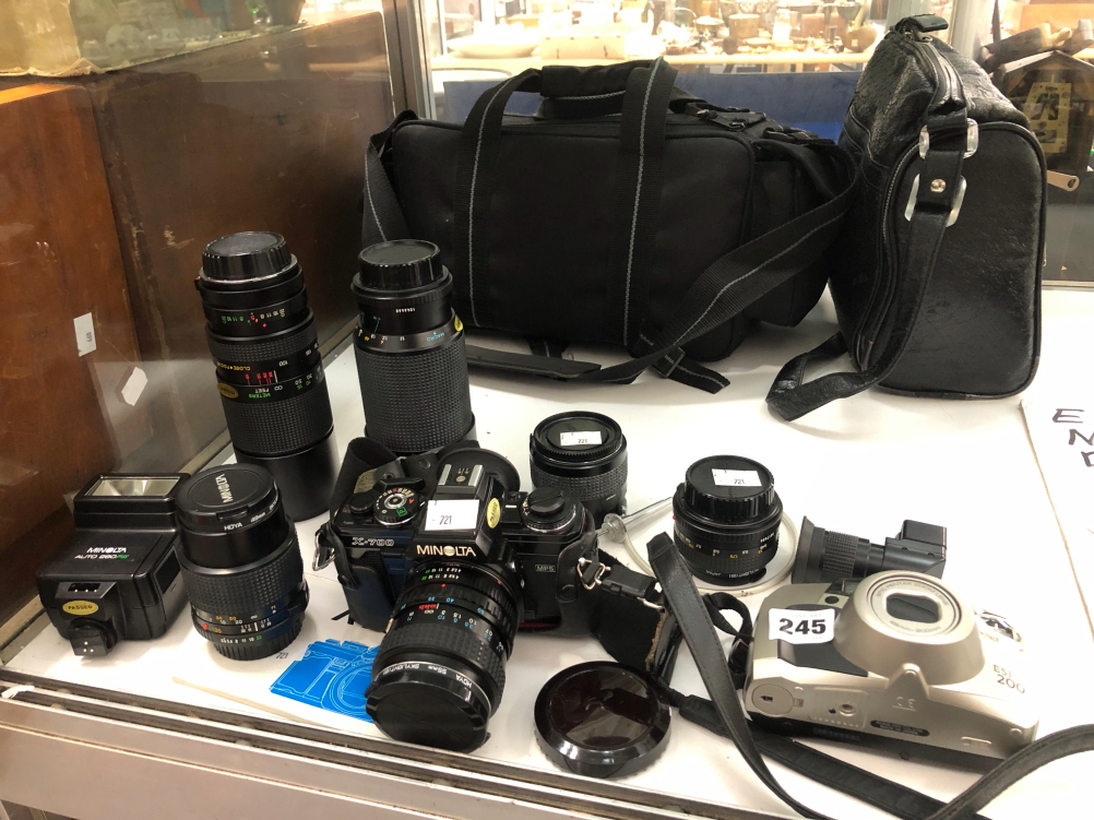 A MINOLTA X-700 CAMERA, SIX VARIOUS LENSES TOGETHER WITH A PENTAX ESPIO 200 CAMERA