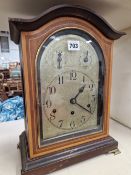A GERMAN SATIN WOOD BANDED MAHOGANY MANTEL CLOCK, THE MOVEMENT CHIMING ON RODS, THE SILVERED DIAL