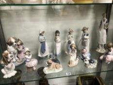 A COLLECTION OF THIRTEEN NAO AND LLADRO FIGURINES